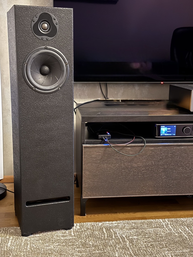 Finished floor-standing prototype in the listening room, beside the streamer cabinet